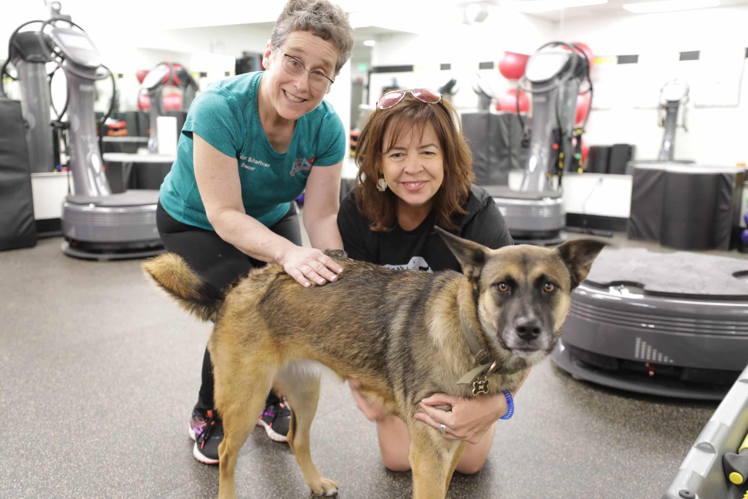 Gym owner Susan Schaffner with gym member and furry friend at AFAC in Thornton, CO