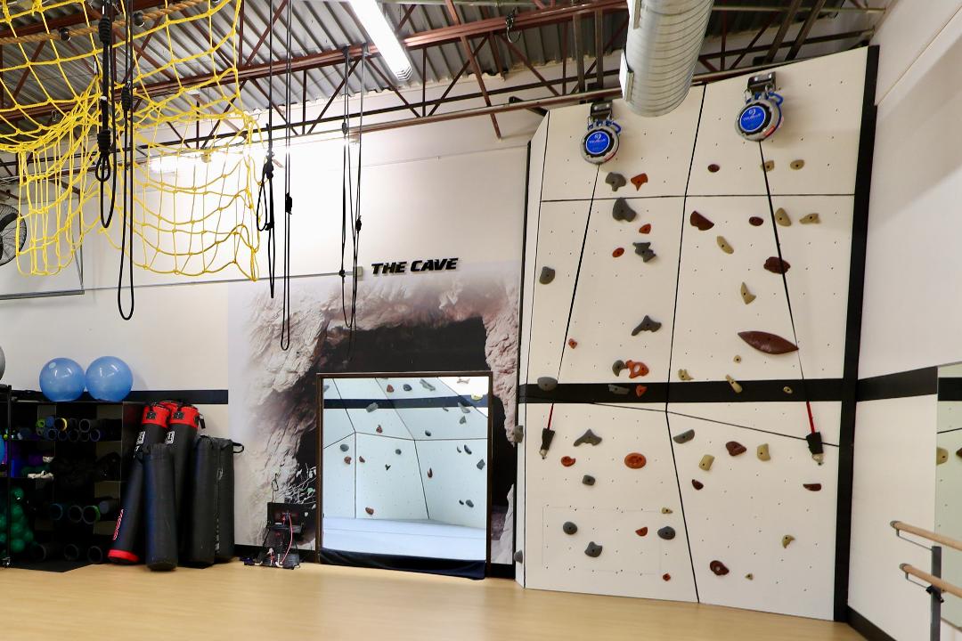 The double auto-belay climbing walls and climbing cave at AFAC gym
