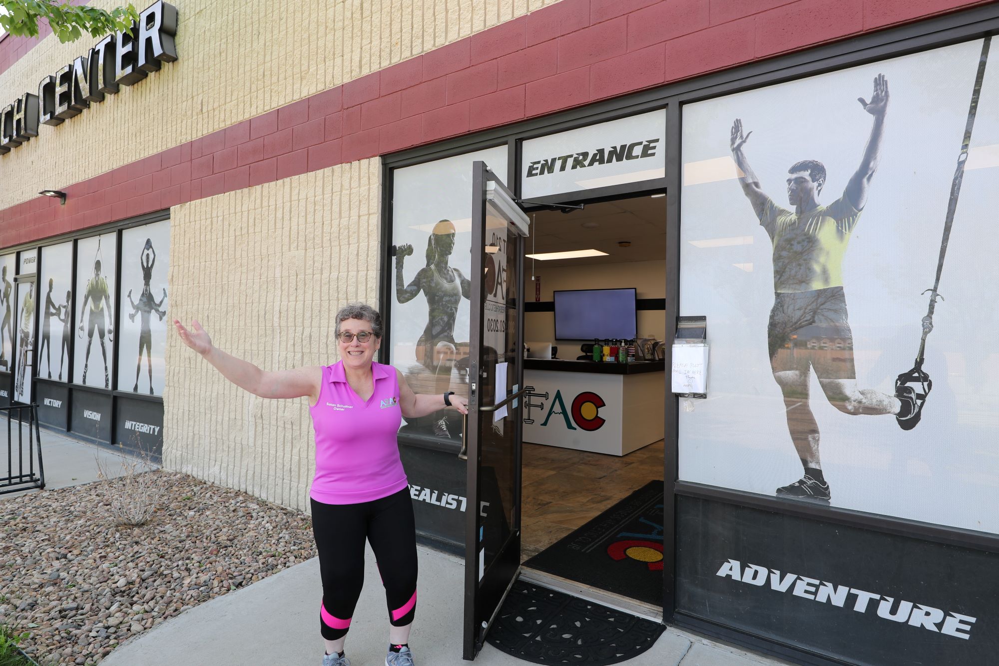 AFAC gym owner Susan Schaffner opening the door to AFAC gym