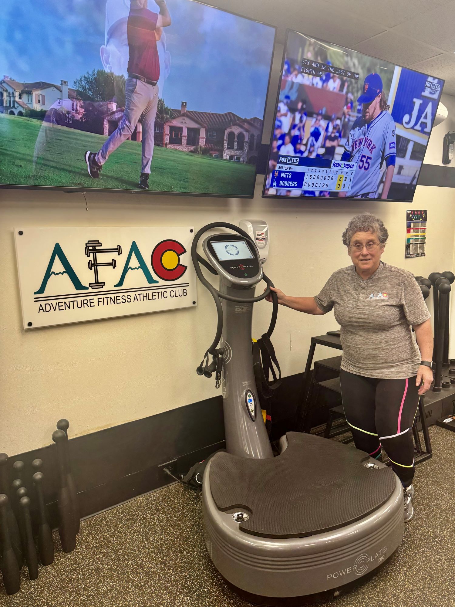 AFAC gym owner Susan Schaffner stands by a Power Plate