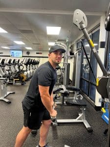 Man pulling down on cable machine at AFAC gym