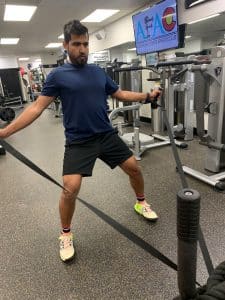 Man working out with resistance sled at AFAC gym