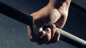 Photo of man's hand gripping a barbell