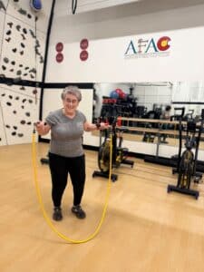 Susan Schaffner, owner of Adventure Fitness Athletic Club, jumps rope in the gym