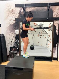 Woman doing box jumps at AFAC gym